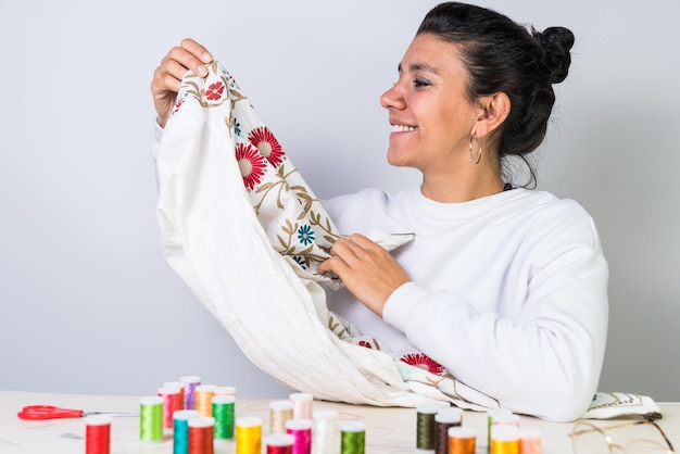 Happy person showing embroidered cloth